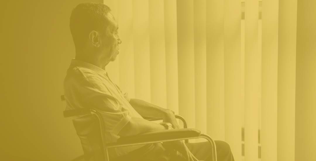 Elder man in wheelchair depressed about elder abuse and nursing home abuse
