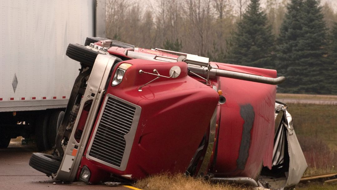 semi truck flipped on side from truck crash