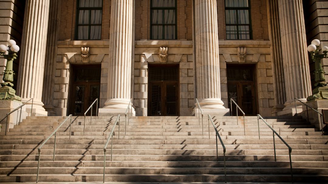 Picture of courthouse with columns view from bottom of steps