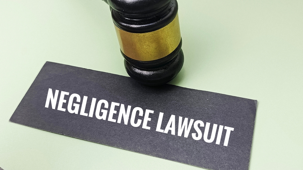 Negligence lawsuit concept with judge gavel representing legal liability, court proceedings, compensation, and risk management